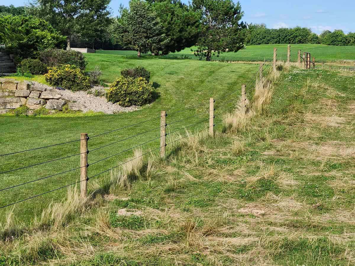 Fence with Electric fence installed around a farm property in Madison Wisconsin in Madison Wisconsin