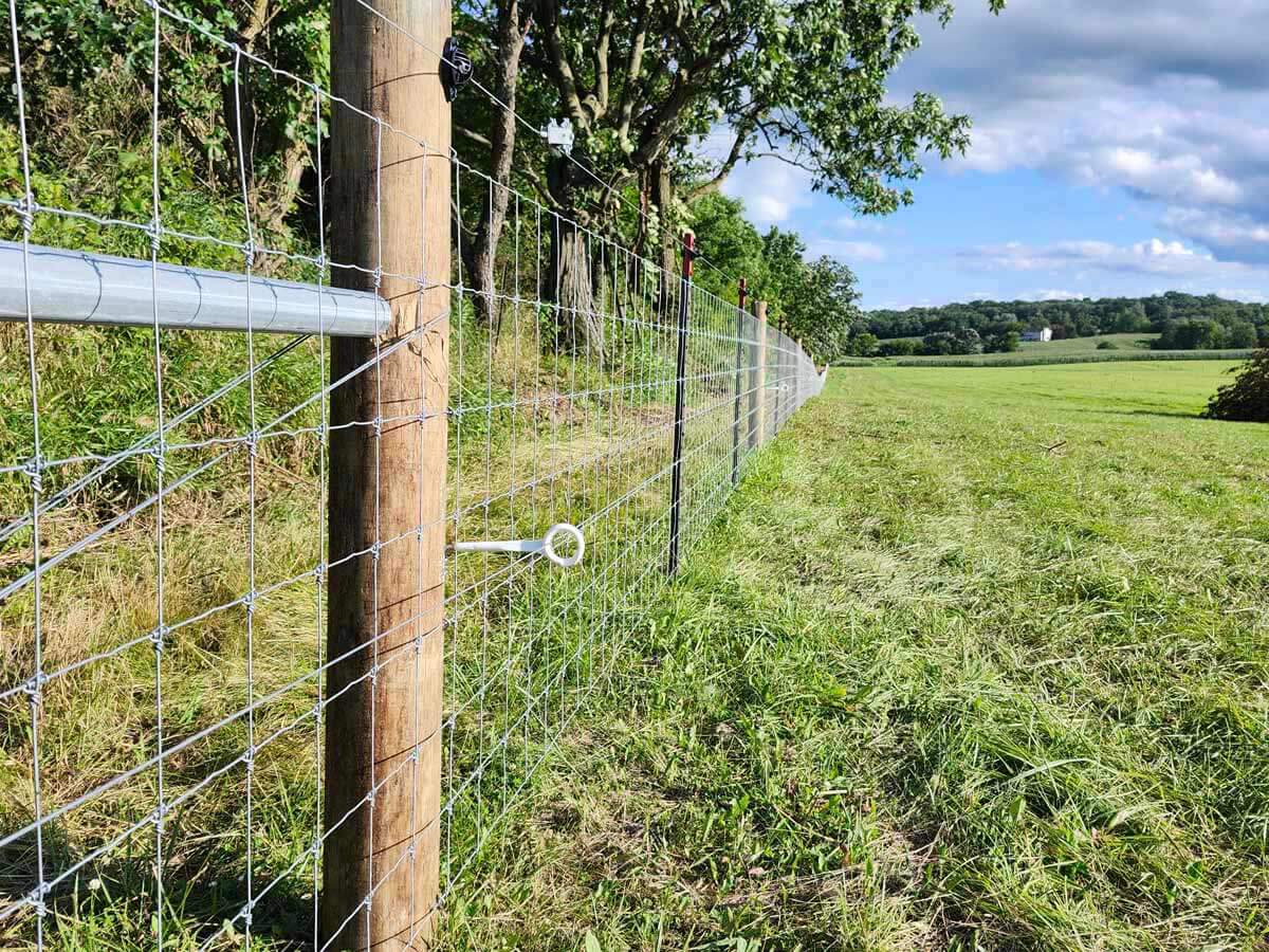 Fence with Woven wire fence installed in Madison Wisconsin around an agricultural property in Madison Wisconsin