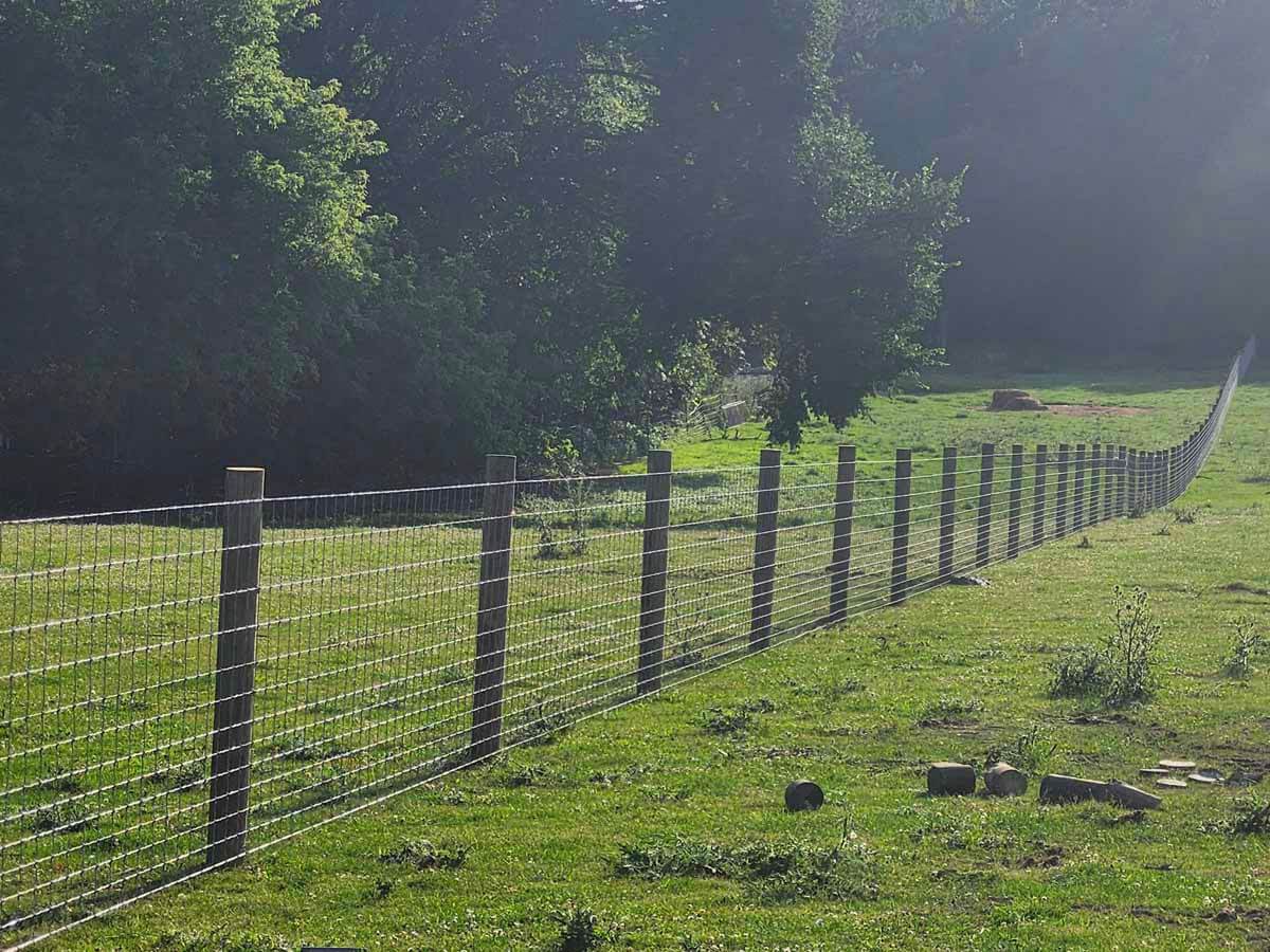 Fence with Woven wire fence installed in Madison Wisconsin around an agricultural property in Madison Wisconsin