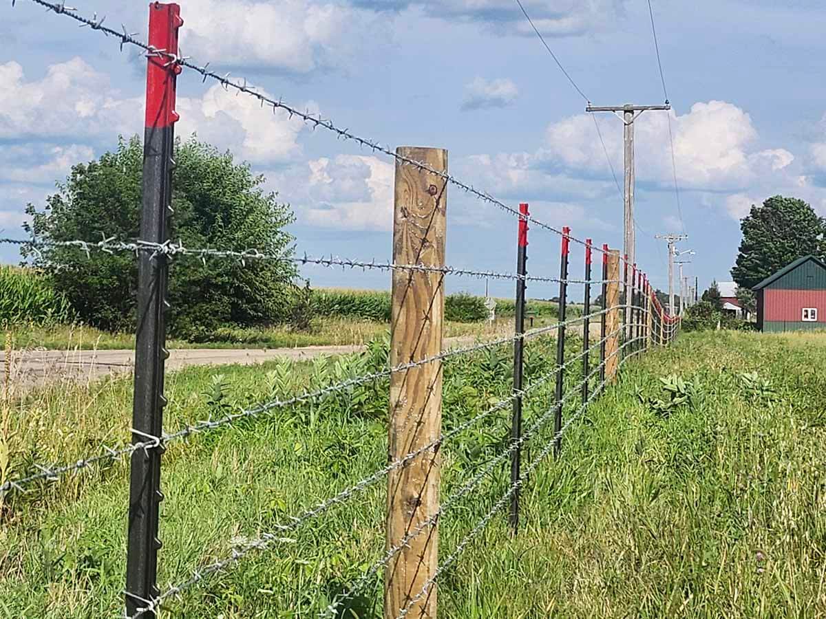 Fence with Barbed wire fence installed in Madison Wisconsin around an agricultural property in Madison Wisconsin