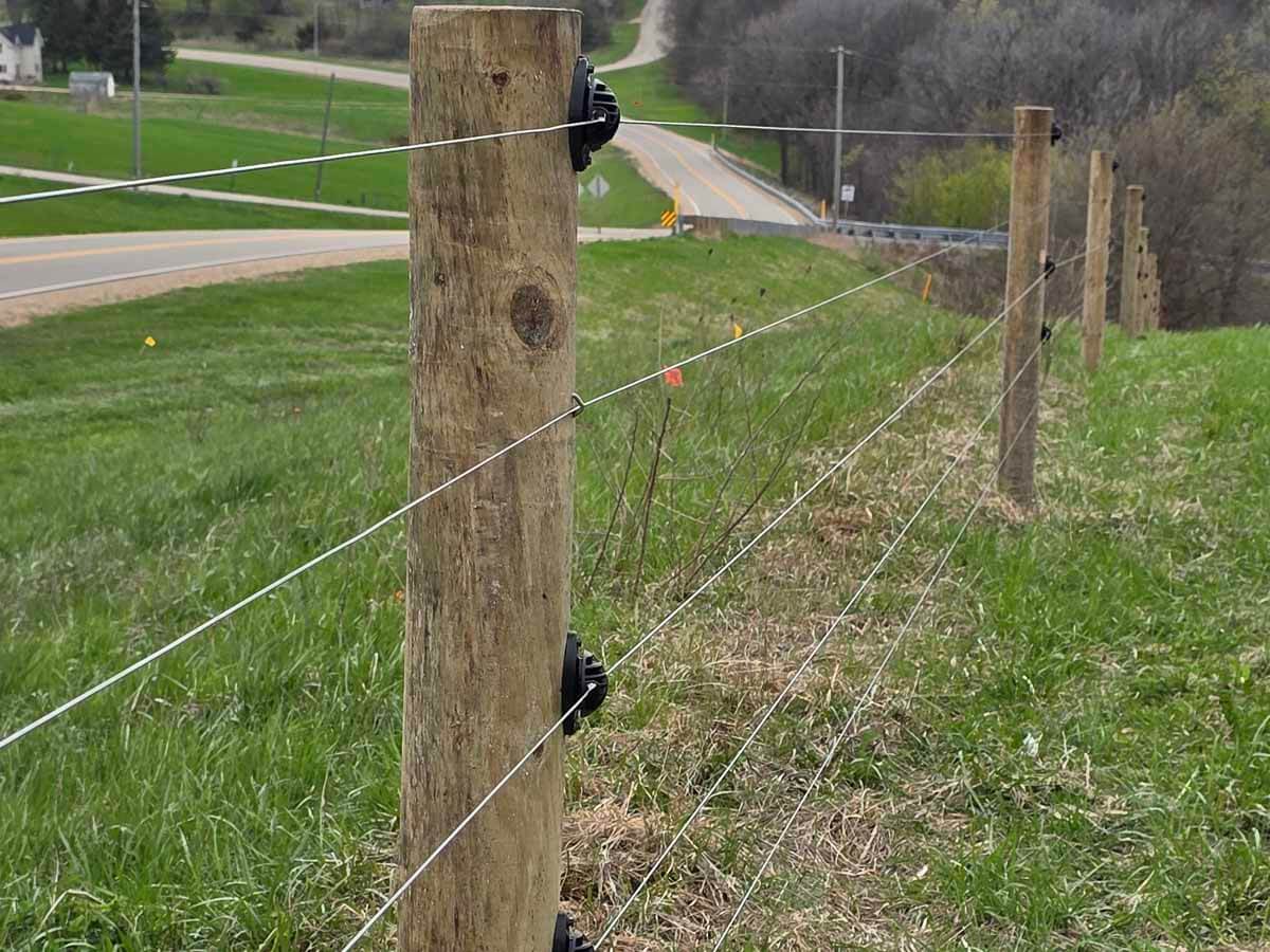 Fence with Electric fence installed on the edge of a property in Madison Wisconsin in Madison Wisconsin