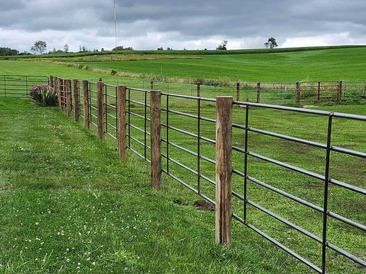 Fence with Metal fence installed around an agricultural property in Madison Wisconsin in Madison Wisconsin
